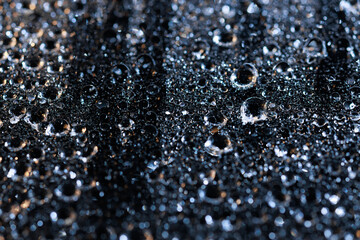 macro close-up of water droplets on a dark background. Mockup for your logo. horizontal wallpaper or web banner.