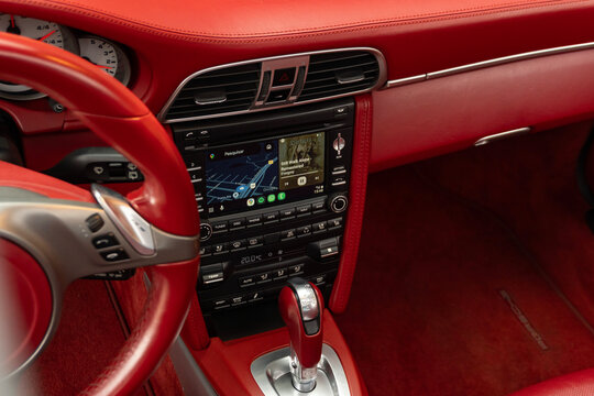Porsche 911 Carrera 4S red leather center console, luxury sportscar interior