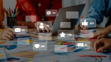 A dynamic office scene showcasing a creative team engaged in social media project work. The image highlights collaboration, technology, and data visualization. Raster