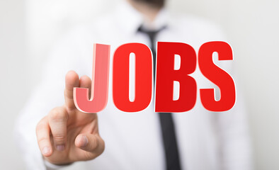 A man's finger pointing at the word JOBS, a visual representation of career opportunities, employment, and the job market. Perfect for business