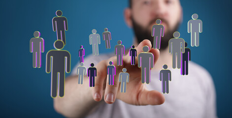 Conceptual image of a hand interacting with a digital representation of people, symbolizing networking and human connections.