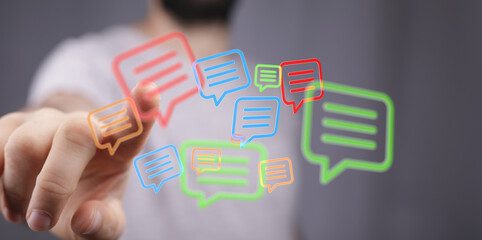 Concept image representing digital communication with bright message bubbles and modern interface with finger touching the icons.
