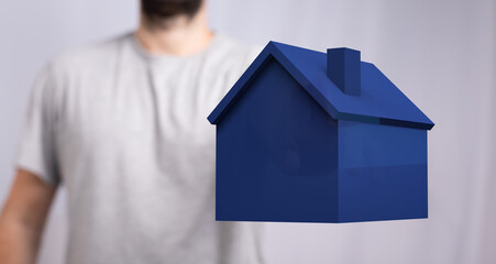 Abstract image of a person holding a blue house. Suitable for real estate, home ownership, finance and related concepts.