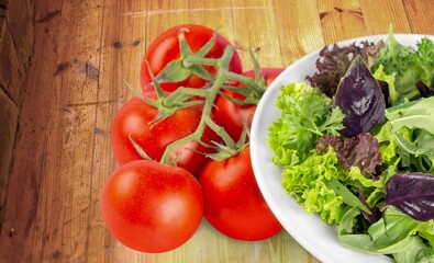 Tasty healthy fresh salad bowl with ingredients.