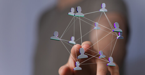 A hand touches a digital network illustration. This conceptual image represents connection,...