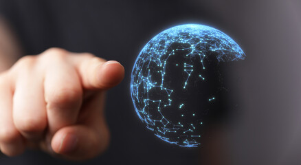 A person's hand pointing at a glowing digital globe. Symbolizing connectivity, global networks, and technological advancement. Ideal for concept