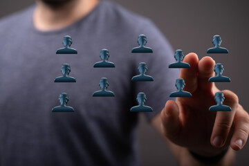 Hand pointing at digital team icons symbolizes business strategy, connection, leadership and networking. Perfect for collaborative projects and