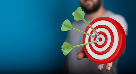 Image of a dartboard with darts perfectly hitting the bullseye, representing success, accuracy, and...