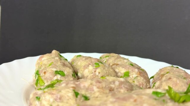 Close-up of raw meat keftedes. Traditional Cypriot food, Mediterranean cuisine.