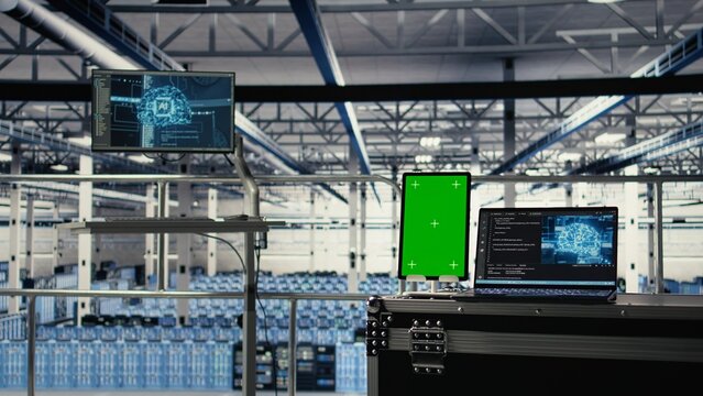 Green screen tablet in server room with machine learning technology detecting data patterns. Chroma key device in data center ensuring rapid data access and transfer rates for AI processing - Powered by Adobe