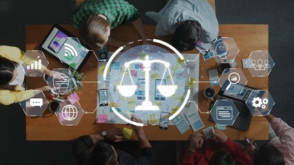 A dynamic team engages in a collaborative meeting with technology and graphics symbolizing law and compliance, highlighting partnership and innovation in the workplace. Raster