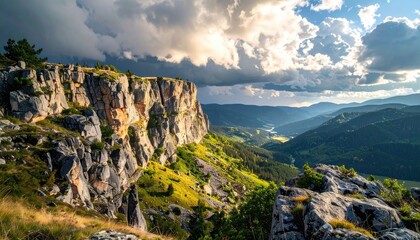 Dramatic Mountain Landscape with Stormy Clouds and Sunlit Valley Below