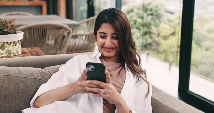 Social media, reading or happy woman with phone on sofa, funny caption or comic message on network app. Laugh, joke reply or person with mobile for communication, browsing internet or texting in home