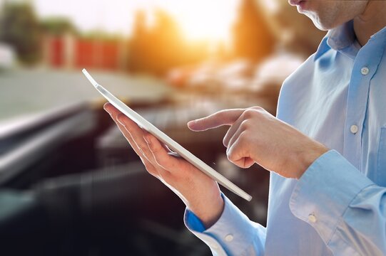 Auto car service concept. Mechanic with clipboard