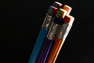 Group of colorful pencils with dark background