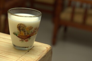 Minimalist Glass of Milk on Neutral Background