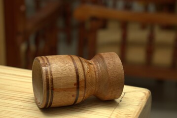 Wooden gavel lying on table