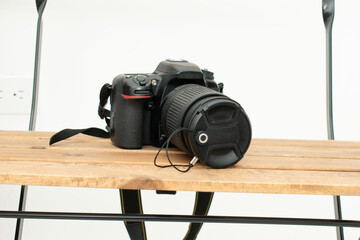 DSLR camera front view on shelf