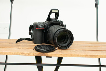 Black DSLR camera with lens cap