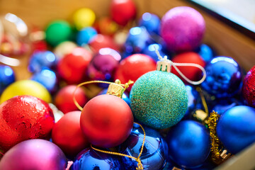 Wide variety of colorful Christmas balls with a string to hang and decorate the tree