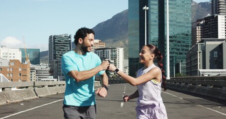 Fitness, running and couple on highway in city for health, training or wellness together for bonding. Sports, talking and man with woman for cardio exercise or workout on bridge in urban town. - Powered by Adobe