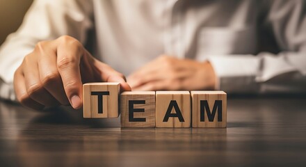 Building a strong team for business success with collaborative wooden blocks spelling TEAM, perfect for leadership, teamwork, and company culture initiatives