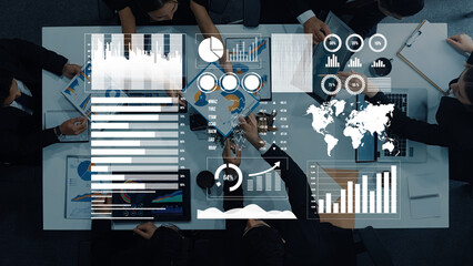 A diverse group of professionals collaborates in a modern office, utilizing data visualization tools for financial analysis and strategic planning. Axiom