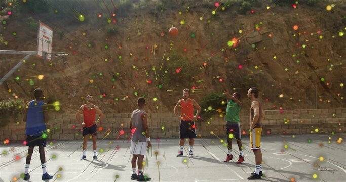 Shooting player in green top with teammates on hillside court with basketball hoop, light effects - Powered by Adobe
