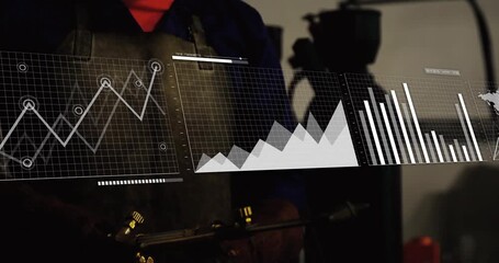 Artisan looking in workshop starting hologram line graph into world map overlay monitoring data - Powered by Adobe