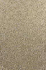 Taupe-gold brocade fabric texture with wave pattern and metallic gold lurex, textile collection