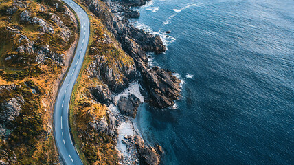Scenic Coastal Road Along Rocky Shoreline with Ocean View