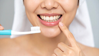 Close observation of the mouth during morning cleansing ritual, revealing healthy lower teeth and pink gums with dental brush near face.