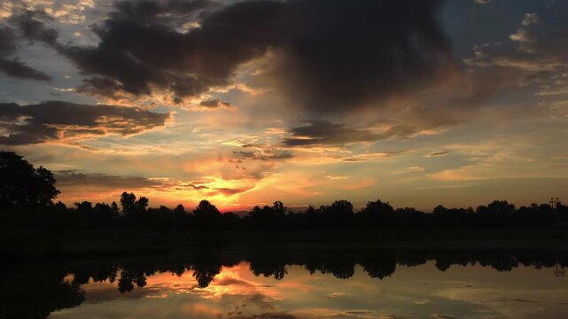 Sunrise Reflection in Lake Timelapse Zoom Out
