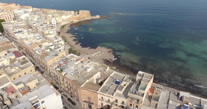 Aerial view of Torrino Conca and the beach of the Mura di Tramontana, located in the historic center of Trapani, Sicily, Italy. It is a beautiful city overlooking the Mediterranean Sea.
