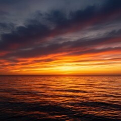 Obraz premium The vast ocean meets the horizon under a spectacular, fiery sunset. Tranquil scene of water reflecting dramatic, warm colors during dusk ,summer ,marine ,Sea