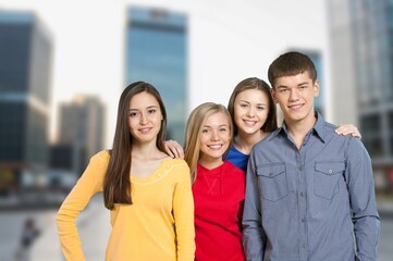 Multiethnic happy young friends students hanging outside