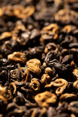 close up of tea. black tea leaves. black tea background