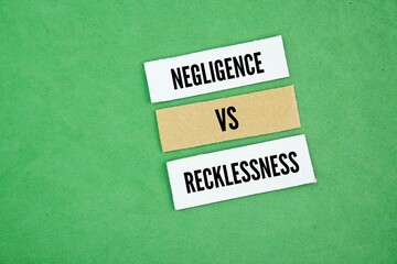 Square paper with the words Negligence vs Recklessness. Negligence is the failure to exercise reasonable care, while recklessness is a conscious disregard for a substantial and unjustifiable risk.