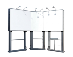 Three blank billboards meet in a corner; silver metal framing. Illuminated by lights. Isolated on a black background
