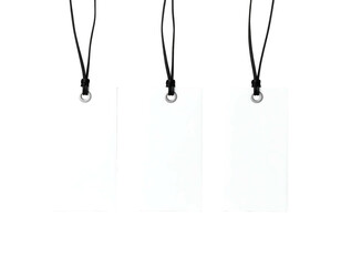 Three blank white tags hang from black strings against a stark black background, evenly spaced