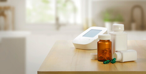 "Vitamins and dietary supplements bottles on kitchen background, healthy lifestyle concept"