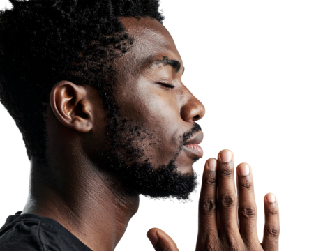 Profile of a man with closed eyes and clasped hands, deep in thought against a dark background