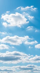 Naklejka premium Vast bright blue summer sky background filled with soft white cumulus clouds gently moving with a light breeze on a perfect sunny day ,daytime ,cloud ,breezy