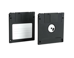 Two black floppy disks, one with a label, face up on black background