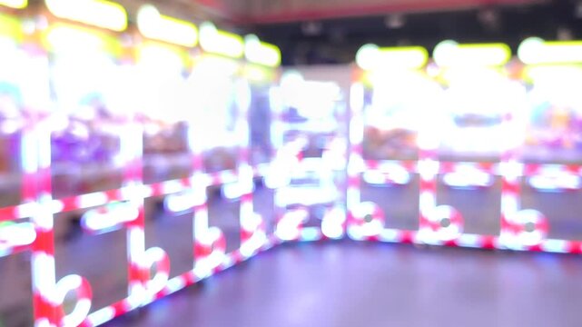 Blurred of chase LEDs on claw machine, indoor Chiangmai Thailand.