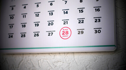 Close-up of Black Friday date 2025 on a wall calendar page