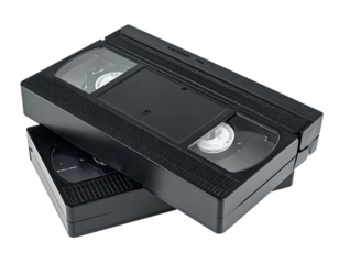 Two black VHS tapes stacked slightly angled against a black backdrop, showcasing their rectangular shapes