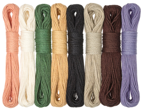 Row of muted colorful embroidery floss skeins, wrapped in paper, against a neutral background