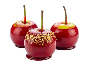 Three candied apples, one covered in nuts, red and glossy, with a stem against a black background