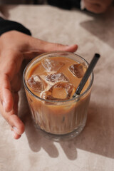 Enjoying a chilled iced coffee on a sunny afternoon